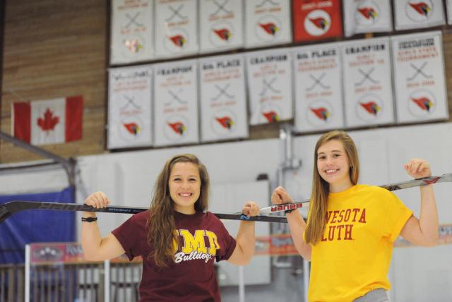 Alexandria junior McKenzie Revering (left) and senior Lauren Niska wear their University of Minnesota-Duluth gear on the ice at the Runestone Community Center on October 15. Both players recently gave verbal commitments to play their college hockey for the Bulldogs.